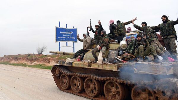 In this photo released Wednesday, Feb. 12, 2020, by the Syrian official news agency SANA, Syrian government soldiers on a tank hold up their rifles and flash victory signs, as they patrol the highway that links the capital Damascus with the northern city of Aleppo, Syria. The M5 highway, recaptured by President Bashar Assad’s forces this week, is arguably the most coveted prize in Syria’s civil war. The strategic highway is vital for Syria’s  economy as well as for moving troops. - Sputnik International