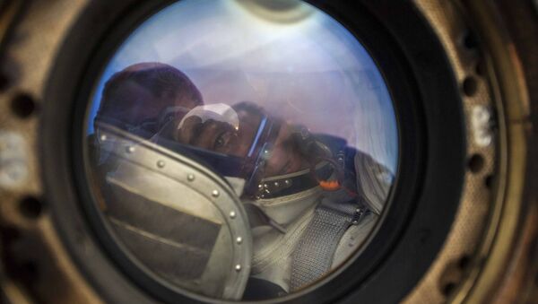 In this handout photo released by Gagarin Cosmonaut Training Centre (GCTC), Roscosmos space agency, NASA astronaut Chris Cassidy sits in the capsule shortly after the landing near town of Dzhezkazgan, Kazakhstan, Thursday, Oct. 22, 2020.  - Sputnik International
