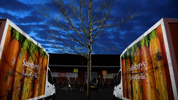Signage for Sainsbury's is seen on delivery vans at a branch of the supermarket in London, Britain, January 8, 2020 - Sputnik International