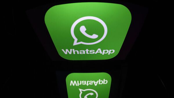 A picture taken on December 28, 2016 in Paris shows the logo of WhatsApp mobile messaging service - Sputnik International