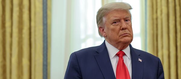 U.S. President Donald Trump participates in a medal ceremony in the Oval Office at the White House in Washington, U.S. December 3, 2020.  REUTERS/Jonathan Ernst - Sputnik International