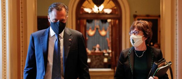 Senators Romney and Collins walk to the office of the Majority Leader from the Senate Chamber ahead of a meeting with Majority Leader McConnell on Capitol Hill in Washington - Sputnik International