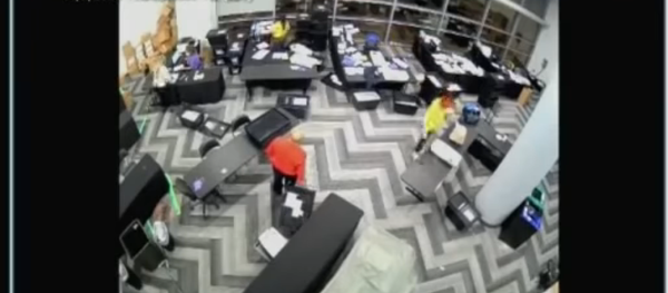 Screenshot from the video allegedly showing election staffers in Fulton County, Atlanta, Georgia, staying behind and pulling out boxes of extra ballots - Sputnik International