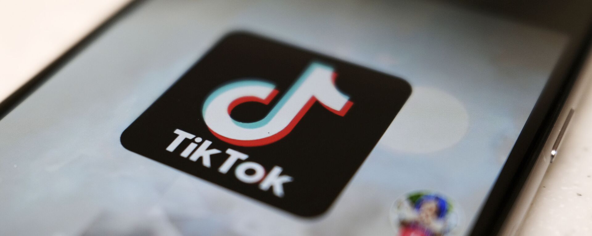 A logo of a smartphone app TikTok is seen on a user post on a smartphone screen Monday, Sept. 28, 2020, in Tokyo - Sputnik International, 1920, 26.02.2021