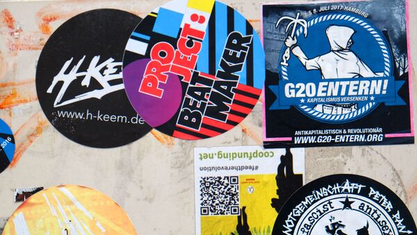 Stickers which adress the G20 summit are pictured on walls and lightpoles in Hamburg, northern Germany on 20 July 2017. - Sputnik International