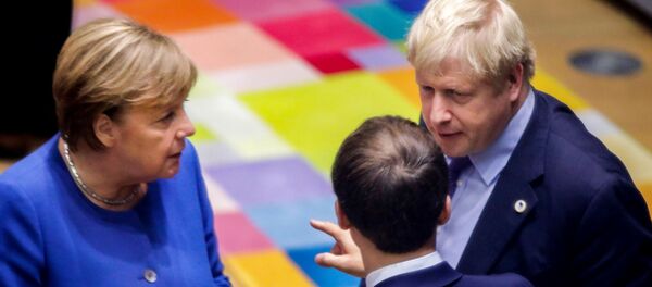 British Prime Minister Boris Johnson (R), French President Emmanuel Macron (C) and German Chancellor Angela Merkel (L) speak upon their arrival for a round table meeting as part of a European Union summit at European Union Headquarters in Brussels on October 17, 2019. British Prime Minister Boris Johnson (R), French President Emmanuel Macron (C) and German Chancellor Angela Merkel (L) speak upon their arrival for a round table meeting as part of a European Union summit at European Union Headquarters in Brussels on October 17, 2019. - Sputnik International