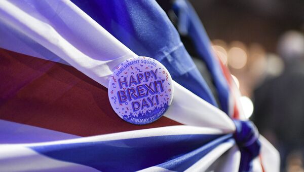 A Brexit pin is attached to a flag, in London, Friday, Jan. 31, 2020 - Sputnik International