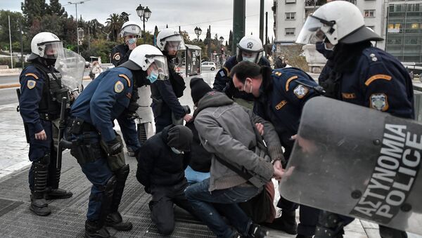 Police arrest demonstrators in Athens during an attempt to demonstrate in front of the Greek Parliament in Athens on December 4, 2020 to commemorate the killing of Alexis Grigoropoulos by the police, which sparked month of rioting across the country in 2008 - Sputnik International