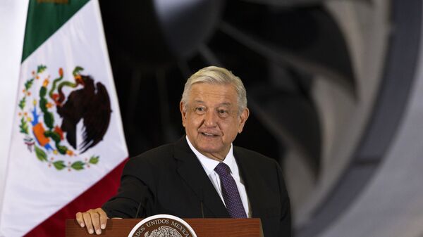 In this July 27, 2020 file photo, Mexican President Andres Manuel Lopez Obrador gives his daily, morning press conference in front of the former presidential plane that has been for sale since he took office, at Benito Juarez International Airport in Mexico City - Sputnik International