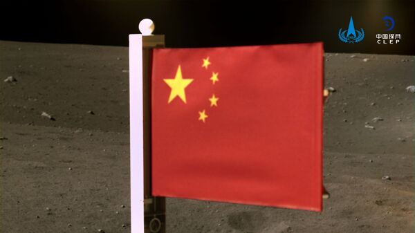 China's national flag is seen unfurled from the Chang'e-5 spacecraft on the moon, in this handout image provided by China National Space Administration (CNSA) December 4, 2020.  - Sputnik International