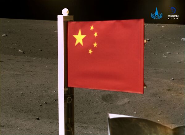 China's national flag is seen unfurled from the Chang'e-5 spacecraft on the moon, in this handout image provided by China National Space Administration (CNSA) 4 December 2020.  - Sputnik International