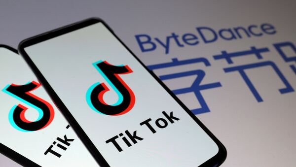 Tik Tok logos are seen on smartphones in front of a displayed ByteDance logo in this illustration taken November 27, 2019. - Sputnik International