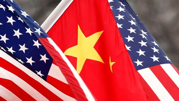 Chinese and U.S. flags fly along Pennsylvania Avenue outside the White House in Washington January 18, 2011 - Sputnik International