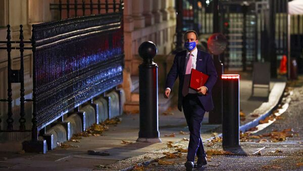 Britain's Health Secretary Matt Hancock wears an NHS face mask outside 10 Downing Street, in London, Britain 16 November 2020. - Sputnik International