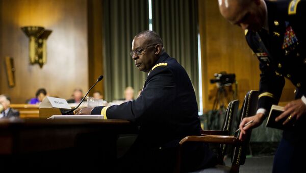 US Central Command Commander Gen. Lloyd Austin III, center seated, looks back to his military aide while testifying on Capitol Hill in Washington, Wednesday, Sept. 16, 2015, before the Senate Armed Services Committee hearing on 'US military operations to counter the Islamic State in Iraq'. - Sputnik International