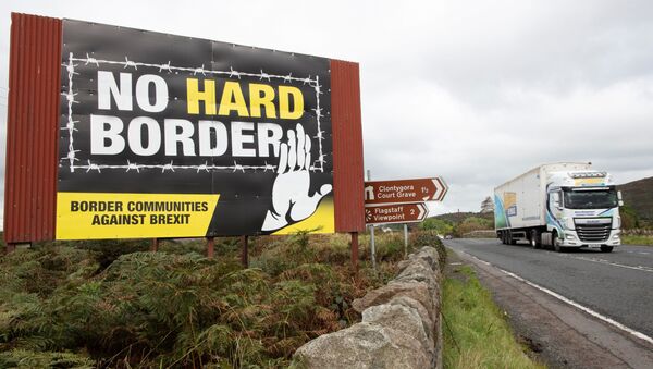 (FILES) In this file photo taken on October 1, 2019 a vechile passes an anti-Brexit pro-Irish unity billboard seen from the Dublin road in Newry, Northern Ireland, on the border between Newry in Northern Ireland and Dundalk in the Irish Republic - Sputnik International