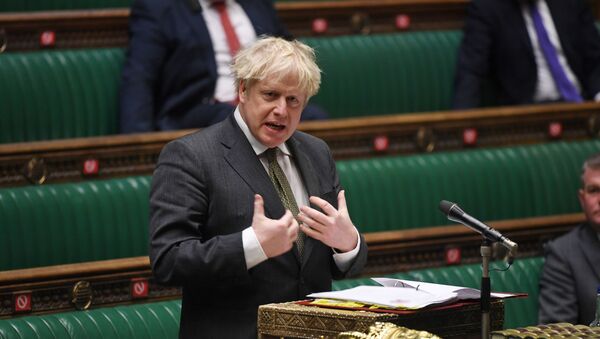 A handout photograph released by the UK Parliament shows Britain's Prime Minister Boris Johnson speaking during Prime Minister's Questions (PMQs) in the House of Commons, in central London on December 9, 2020. - Sputnik International