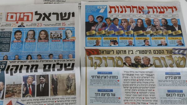 This picture taken on December 11, 2020 in Jerusalem shows Israeli newspapers' front page titles about the announcement that Israel is to establish diplomatic relations with Morocco. - Outgoing President Donald Trump's double announcement of a normalisation of ties between Morocco and Israel and US recognition of Moroccan sovereignty over Western Sahara has prompted mixed reactions. In a statement by the royal palace, Morocco's King Mohammed VI confirmed on December 10 that his country would resume official contacts.... and diplomatic relations with minimal delay with Israel, two decades after the two countries closed liaison offices.  - Sputnik International