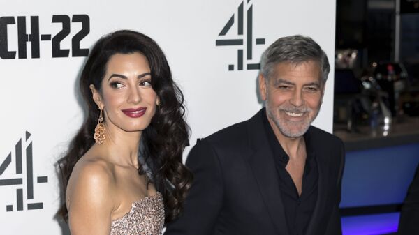 Actor George Clooney and partner Amal Clooney, pose for photographers on arrival at the premiere of the television mini-series 'Catch22', in London, Wednesday, May 15, 2019 - Sputnik International