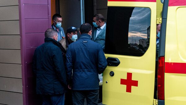 Medics load Alexei Navalny in an ambulance at Omsk Emergency Hospital No 1 where Navalny was admitted after he fell ill in what his spokeswoman said was a suspected poisoning in Omsk on August 22, 2020. - - Sputnik International
