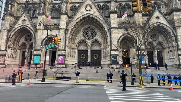 Police are seen outside of the Cathedral of St. John the Divine in New York on December 13, 2020, after a shooter opened fire outside the church before police returned fire and took the man into custody. - Sputnik International