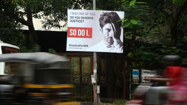 Vehicles drive past a hoarding put up to seek justice following the suicide of actor Sushant Singh Rajput, in Mumbai on September 28, 2020 - Sputnik International