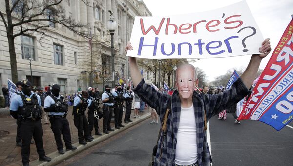 A supporter of President Donald Trump dressed as Joe Biden participates in a demonstration in Freedom Square in Washington, Saturday, December 12, 2020 - Sputnik International