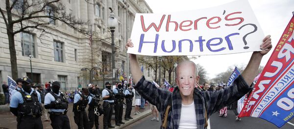 A supporter of President Donald Trump dressed as Joe Biden participates in a demonstration in Freedom Square in Washington, Saturday, December 12, 2020 - Sputnik International