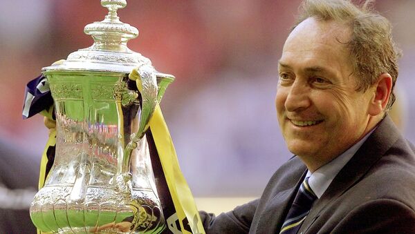 FILE PHOTO: Soccer Football - FA Cup Final - Liverpool v Arsenal - Millennium Stadium, Cardiff, Wales, Britain - 12 May 2001  Liverpool's manager Gerard Houllier holds aloft the FA Cup   - Sputnik International