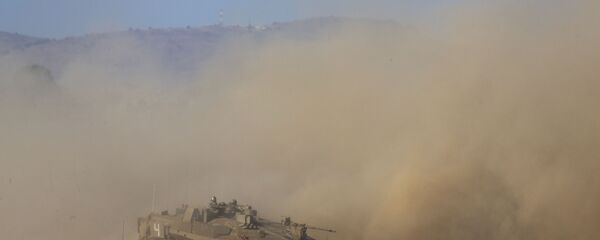 Israeli soldiers drive a tank during an exercise in the Israeli controlled Golan Heights near the border with Syria, Tuesday, Aug. 4, 2020 Israeli soldiers drive a tank during an exercise in the Israeli controlled Golan Heights near the border with Syria, Tuesday, Aug. 4, 2020 - Sputnik International