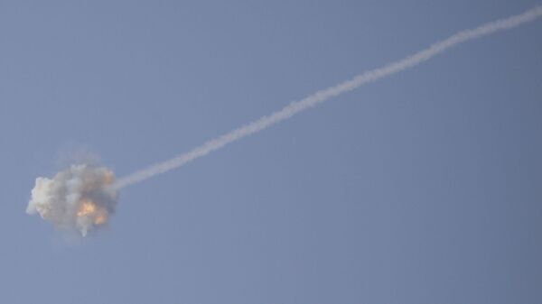 An Israeli Iron Dome air defense system missile is seen intercepting rockets fired from Gaza over Sderot, southern Israel, Wednesday, Nov. 13, 2019. - Sputnik International