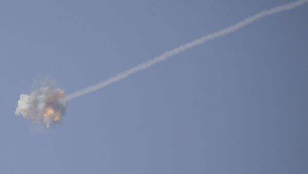 An Israeli Iron Dome air defense system missile is seen intercepting rockets fired from Gaza over Sderot, southern Israel, Wednesday, Nov. 13, 2019. - Sputnik International
