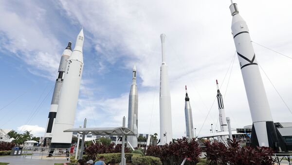 Guests relax in the rocket garden at the Kennedy Space Center Visitor Complex during the Apollo 11 anniversary, Saturday, July 20, 2019, in Cape Canaveral, Fla. - Sputnik International