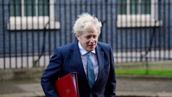 British Prime Minister Boris Johnson leaves 10 Downing Street to attend a cabinet meeting at the Foreign and Commonwealth Office (FCO) in London, Britain December 15, 2020 - Sputnik International