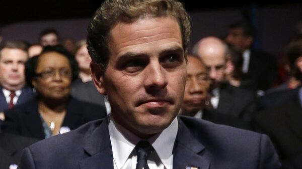 In this Oct. 11, 2012, file photo, Hunter Biden waits for the start of the his father's, Vice President Joe Biden's, debate at Centre College in Danville, Ky. In 2014, then-Vice President Joe Biden was at the forefront of American diplomatic efforts to support Ukraine's fragile democratic government as it sought to fend off Russian aggression and root out corruption. So it raised eyebrows when Biden's son Hunter was hired by a Ukrainian gas company. President Donald Trump prodded Ukraine's president to help him investigate any corruption related to Joe Biden, now one of the top Democrats seeking to defeat Trump in 2020 - Sputnik International
