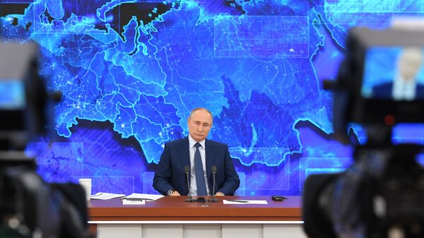 Russian President Vladimir Putin speaks during his annual end-of-year news conference, held online in a video conference mode, at the Novo-Ogaryovo state residence outside Moscow, Russia - Sputnik International
