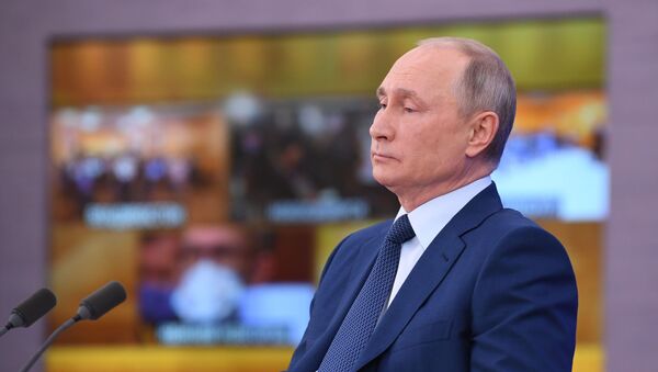 Russian President Vladimir Putin delivers his annual end-of-year news conference, held online in a video conference mode, at the Novo-Ogaryovo state residence outside Moscow, Russia - Sputnik International