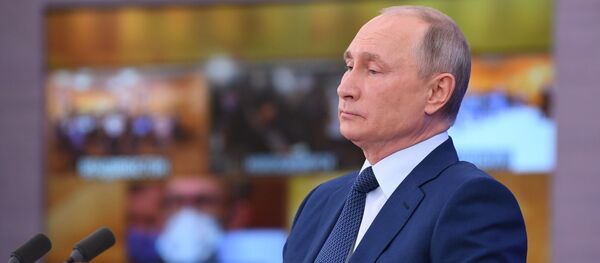 Russian President Vladimir Putin delivers his annual end-of-year news conference, held online in a video conference mode, at the Novo-Ogaryovo state residence outside Moscow, Russia - Sputnik International