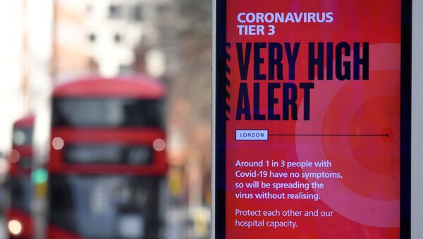 A British government health information advertisement highlighting new restrictions amid the spread of the coronavirus disease (COVID-19) is seen in London, Britain, 19 December 2020.  - Sputnik International