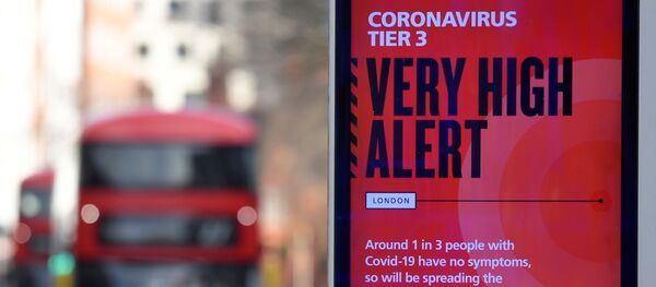 A British government health information advertisement highlighting new restrictions amid the spread of the coronavirus disease (COVID-19) is seen in London, Britain, 19 December 2020.  - Sputnik International