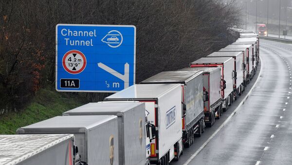 Lorries are parked on the M20 motorway towards Eurotunnel and the Port of Dover, as EU countries impose a travel ban from the UK following the coronavirus disease (COVID-19) outbreak, in Folkestone, Britain, 21 December 2020 - Sputnik International