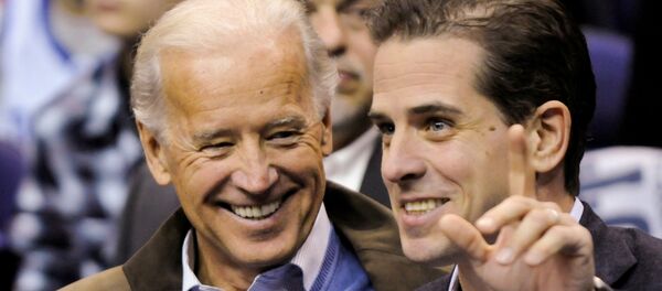 FILE PHOTO: Then-U.S. Vice President Joe Biden and his son, Hunter Biden,  attend an NCAA basketball game between Georgetown University and Duke University in Washington, U.S., January 30, 2010. REUTERS/Jonathan Ernst/File Photo - Sputnik International