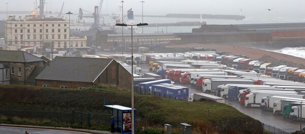 Freight lorries and goods vehicles are pictured parked in a paring lot near the Port of Dover in in Dover, Kent, on the south east coast of England on December 21, 2020 - Sputnik International