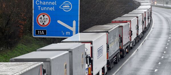 Lorries are parked on the M20 motorway towards Eurotunnel and the Port of Dover, as EU countries impose a travel ban from the UK following the coronavirus disease (COVID-19) outbreak, in Folkestone, Britain, December 21, 2020 - Sputnik International