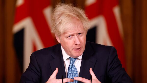 Britain's Prime Minister Boris Johnson speaks during a virtual news conference, after chairing a COBRA meeting, which was called in response to increased travel restrictions amid the coronavirus disease (COVID-19) pandemic, at 10 Downing Street, in London, Britain, December 21, 2020 - Sputnik International