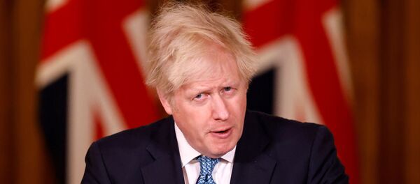 Britain's Prime Minister Boris Johnson speaks during a virtual news conference, after chairing a COBRA meeting, which was called in response to increased travel restrictions amid the coronavirus disease (COVID-19) pandemic, at 10 Downing Street, in London, Britain, December 21, 2020 - Sputnik International