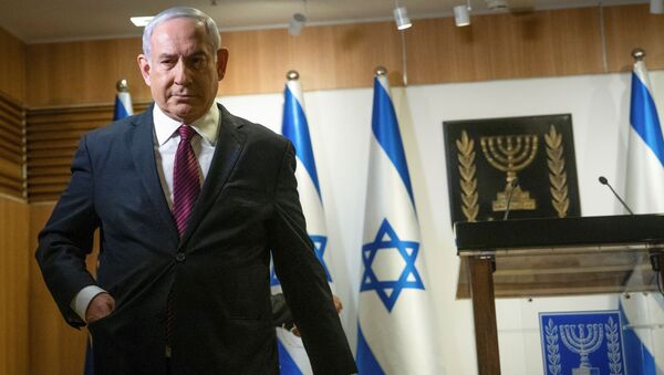 Israeli Prime Minister Benjamin Netanyahu walks after he delivered a statement at the Knesset (Israel's parliament) in Jerusalem, December 22, 2020 - Sputnik International