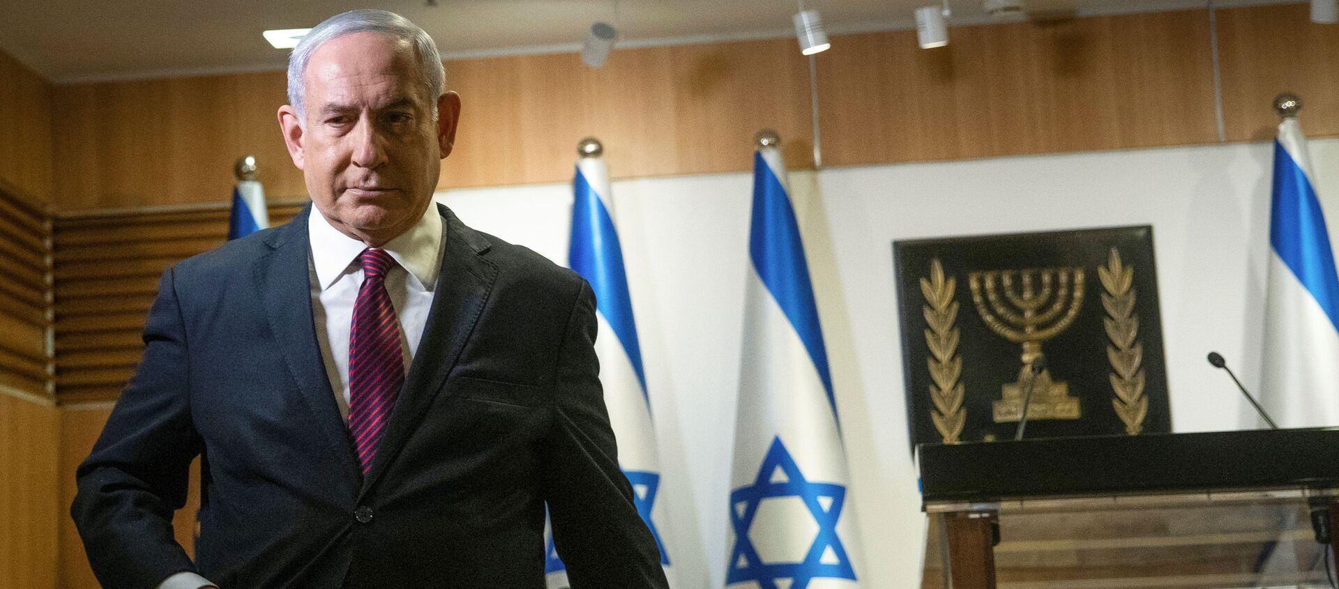 Israeli Prime Minister Benjamin Netanyahu walks after he delivered a statement at the Knesset (Israel's parliament) in Jerusalem, December 22, 2020 - Sputnik International, 1920, 05.01.2021