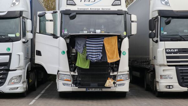 Clothes and towels hang to dry on a lorry at Ashford International Truck Stop, as EU countries impose a travel ban from the UK after the coronavirus disease (COVID-19) outbreak, in Ashford, Britain - Sputnik International