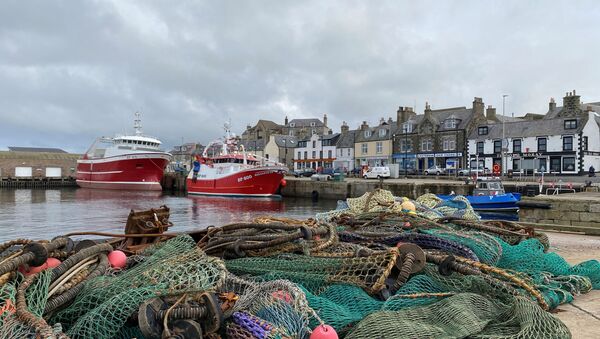 View of fishing boats and a net in the coastal town of Macduff, Aberdeenshire, Scotland, Britain October 18, 2020 - Sputnik International